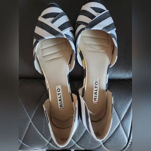 Black and white slip on shoes some lighting makes it blue.